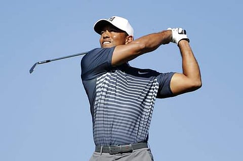 Tiger Woods watches his tee shot on the 15th hole on the North Course at Torrey Pines Golf Course during the second round of Farmers Insurance Open golf tournament. | Photo: AP