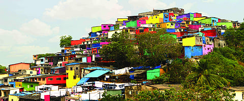 A colorful paint job has transformed one of Mumbai’s drab hilltop slums into a tourist destination, prompting comparisons with Italy’s picturesque Amalfi Coast. (Photo: Reuters)