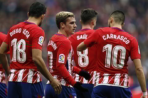 Atletico Madrid's Antoine Griezmann, centre, celebrates with teammates after scoring the opening goal against Girona during a Spanish La Liga soccer match between Atletico Madrid and Girona. | AP