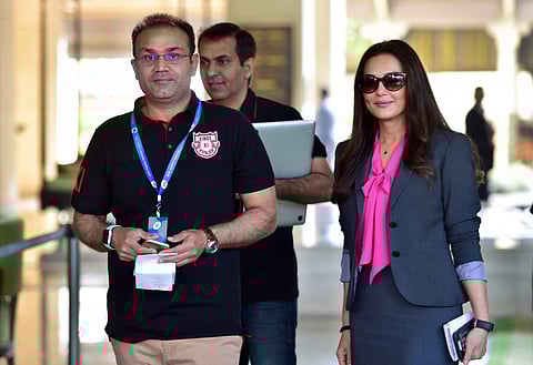 King's XI Punjab Co-Owner Priety Zinta with team mentor Virendra Sehwag arrives to take part in the IPL Auction 2018 on its second day in Bengaluru on Sunday. | PTI