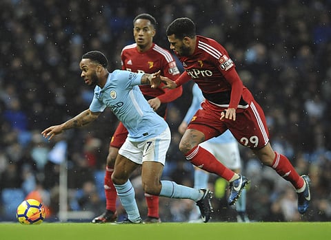 Watford's Etienne Capoue (right) competes for the ball with Manchester City's Raheem Sterling during the English Premier League soccer match. Raheem Sterling scored the quickest goal of the Premier League season at 38 seconds to set Manchester City on its