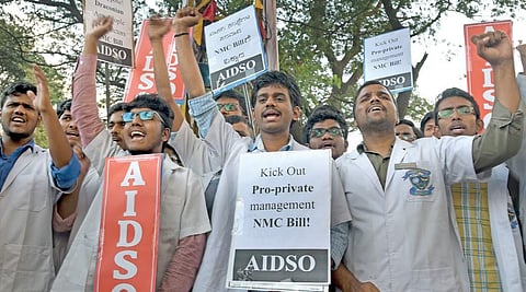 AIDSO activists stage protest against National Medical Commission Bill in Bengaluru on Tuesday  | Vinod Kumar T