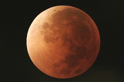A file image of the moon taking on different orange tones during a lunar eclipse seen from Mexico City. (Photo | AP)