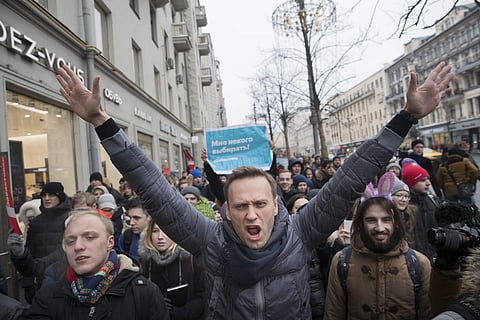 Russian opposition leader Alexei Navalny, centre, attends a rally in Moscow (FIle | AP)