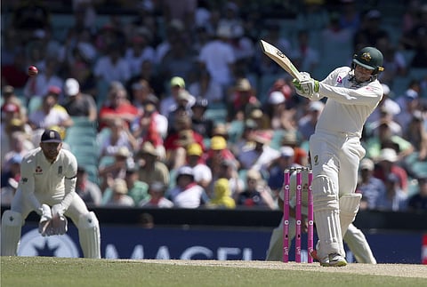 Australia's Usman Khawaja, right, pulls a ball against England during the second day of their Ashes cricket test match in Sydney, Friday, Jan. 5, 2018. | AP