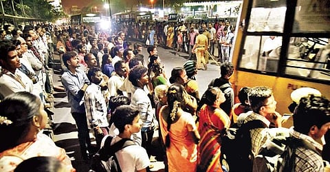 Stranded passengers at the Koyambedu bus terminus in the city on Thursday evening | P jawahar