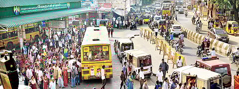 People stranded in Ambattur bus stop following the strike by MTC unions, on Friday | D SAMPATH KUMAR