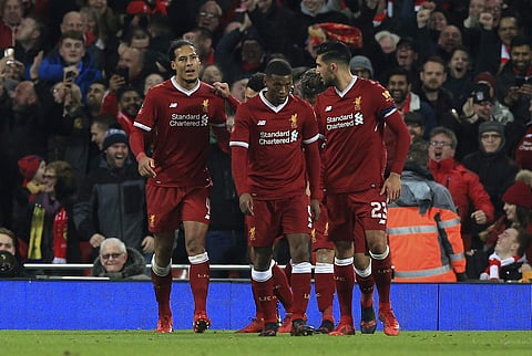 Liverpool's Virgil van Dijk, left, celebrates scoring his side's second goal of the game against Everton during the English FA Cup Third Round soccer match between Liverpool and Everton at Anfield in Liverpool. | AP