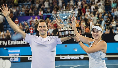 Roger Federer and Belinda Bencic of Switzerland celebrate winning the final at the Hopman Cup tennis tournament in Perth. | AP