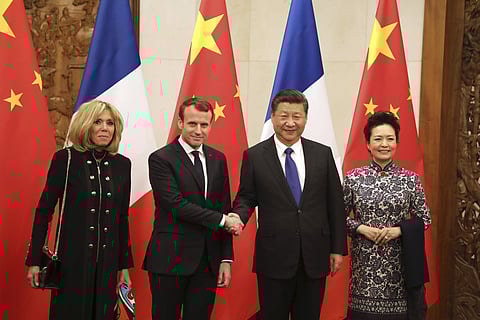 French President Emmanuel Macron, second from left, and his wife Brigitte Macron, left, pose with Chinese President Xi Jinping and his wife Peng Liyuan for a photo during their meeting in Beijing Monday, Jan. 8, 2018. | AP