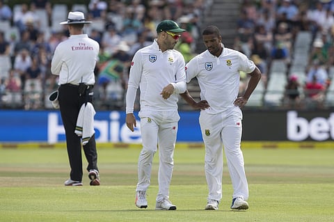 South Africa captain Faf du Plessis, left, discusses strategy with teammate Vernon Philander. | AP