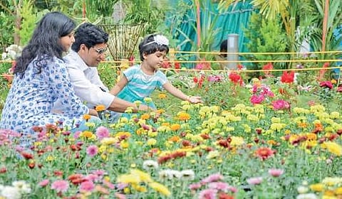 People enjoying the flowers at Vasantholsavam at Kanakakunnu Palace premises  B P Deepu