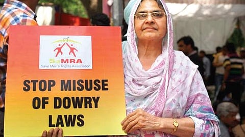 A woman protesting against the misuse of anti-dowry laws