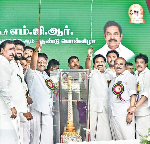 CM Edappadi Palaniswamy and Dy. CM O Pannerselvam display the swords presented by partymen at the centenary celebrations of AIADMK founder M G Ramachandran on Sunday in Chennai. (Photo: EPS / P Jawahar