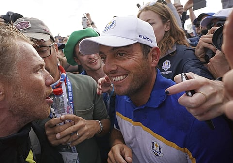 Europe's Francesco Molinari celebrates after winning his singles match to clinch the Ryder Cup for Europe on the final day of the 42nd Ryder Cup at Le Golf National in Saint-Quentin-en-Yvelines, outside Paris, France. | AP