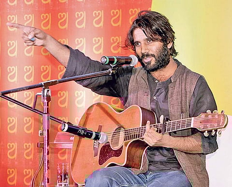 Singer, song writer and poet Kavish Seth performing at the event | Express