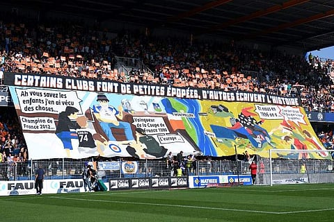 Montpellier's supporters react during the French L1 football match between Montpellier and Nimes, on September 30, 2018 at the the Mosson stadium in Montpellier, southern France.  | AFP