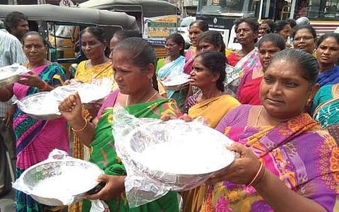 Sanitation workers resort to begging as part of their stir in Vijayawada | Express