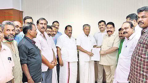 CMRL managing director S N Sasidharan Kartha handing over a cheque for J2.58 crore to Chief Minister Pinarayi Vijayan as donation to the CMDRF. Industries Minister E P Jayarajan and CMRL joint managing director Sharan S Kartha are also seen