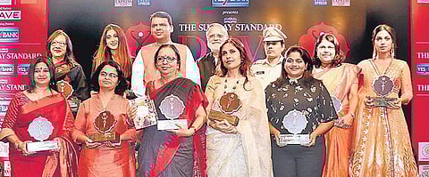 Winners of the 2018 Devi Awards with Maharashtra Chief Minister Devendra Fadnavis and Editorial Director of The New Indian Express and The Sunday Standard,  Prabhu Chawla, in Mumbai on Wednesday. | EPS