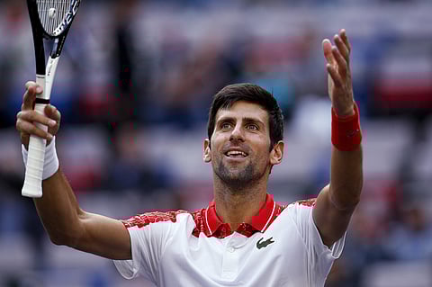 Novak Djokovic of Serbia gestures to the spectators after defeating Marco Cecchinato of Italy in their men's singles match of the Shanghai Masters | AP