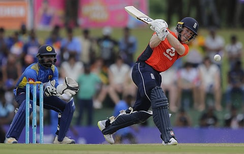 England's Eoin Morgan plays a shot as Sri Lanka's wicketkeeper Niroshan Dickwella watches during their second one-day international cricket match in Dambulla. (Photo | AP)