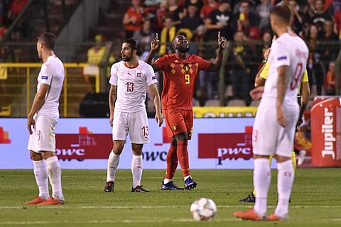 Belgium's Romelu Lukaku, background celebrates after scoring his side's first goal during the UEFA Nations League soccer match between Belgium and Switzerland | AP