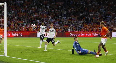 Netherland's Memphis Depay scores his side's second goal against Germany's keeper Manuel Neuer during the UEFA Nations League match | AP