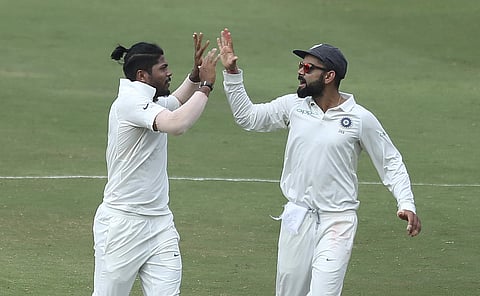 Umesh Yadav's maiden 10-wicket haul (6/88 and 4/45) on a decent track was the highlight as India reached the meagre victory target of 72 in 16.1 overs. (Photo | AP)