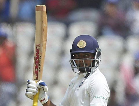 India's Cricketer Prithvi Shaw celebrates scoring fifty during the second day of the second cricket test match between India and West Indies in Hyderabad. | AP