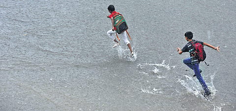 Children have a splash on their way home | Vinod Kumar T