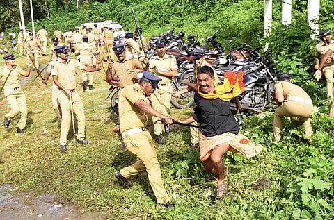Police chasing a protester who was agitating against the Supreme Court verdict. (Photo| B P Deepu/EPS)