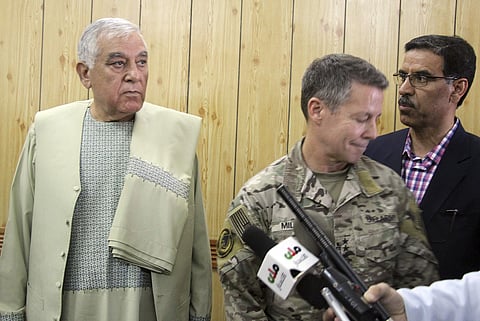 Kandahar Gov. Zalmay Wesa, left, stands with the head of NATO troops in Afghanistan, Gen. Scott Miller, center, and a translator, during a meeting, in Kandahar, Afghanistan. (Photo | AP)