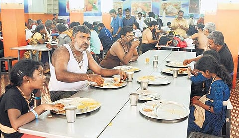 Devotees eat at a hotel at Sannidhanam on Saturday. Hoteliers say fewer number of pilgrims has impacted their revenue | A sanesh
