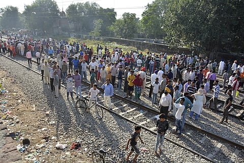 A crowd gathers at the site of Friday's train accident in Amritsar, India, Saturday. (Photo | AP)
