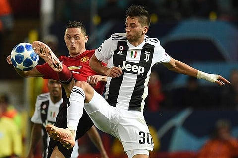 Manchester United's Serbian midfielder Nemanja Matic (L0 vies with Juventus' Uruguayan midfielder Rodrigo Bentancur (R) during the Champions League group H football match between Manchester United and Juventus at Old Trafford in Manchester, north west Eng