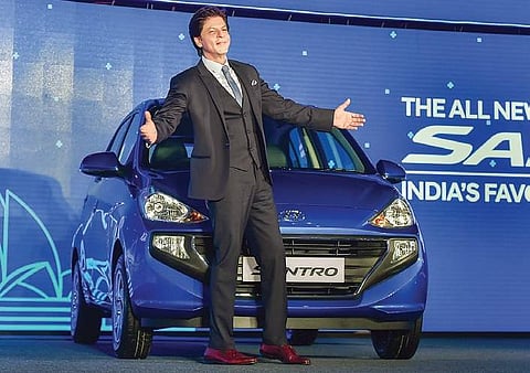 Bollywood actor and Hyundai Motor India Limited’s ambassador Shah Rukh Khan at the launch of the new Santro in New Delhi on Tuesday | pti