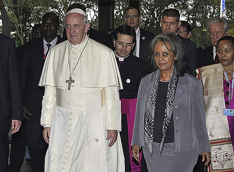 Pope Francis walks next to then Director-General of the United Nations Office at Nairobi (UNON) Sahle-Work Zewde, right, upon his arrival there in Nairobi, Kenya. Ethiopian lawmakers unanimously elected the seasoned diplomat Sahle-Work Zewde as the countr