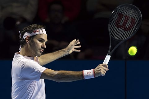 Switzerland's Roger Federer returns a ball to Germany's Jan-Lennard Struff during their round of sixteen match at the Swiss Indoors tennis tournament | AP