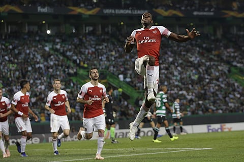 Arsenal's Danny Welbeck celebrates scoring his side's first goal during the Europa League match against Sporting CP  | AP