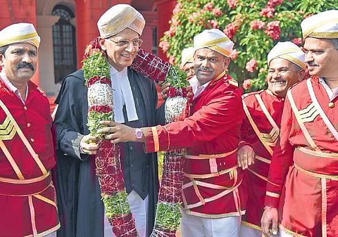 Bengaluru Jamedars garlanding Justice A S Bopanna, who is appointed as Chief Justice of Gauhati High Court on Friday, after the farewell programme held at Karnataka  High Court | Nagaraja Gadekal