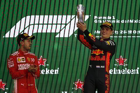 Red Bull driver Max Verstappen, of Netherlands, right, celebrates at the podium winning the Formula One Mexico Grand Prix auto race at the Hermanos Rodriguez racetrack in Mexico City, Sunday, Oct. 28, 2018. | AP