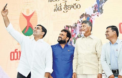 IT Minister Nara Lokesh taking a selfie with Chief Minister Nara Chandrababu Naidu and others during the launch  of Mukhyamantri Yuva Nestham at Undavalli on Tuesday. I Express Photo Services