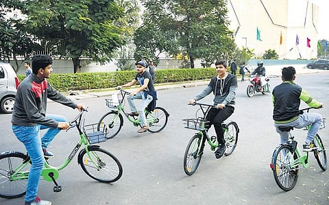 People trying out PEDL's public bicycle sharing service in Koramangala.