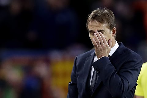 Real coach Julen Lopetegui gestures as walks off the pitch after losing 5-1 during the Spanish La Liga soccer match between FC Barcelona and Real Madrid at the Camp Nou stadium in Barcelona, Spain, Sunday, Oct. 28, 2018.  | AP
