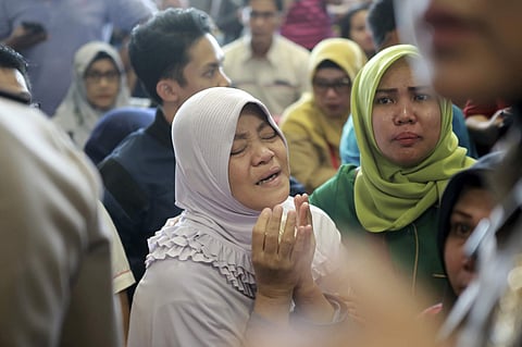 Relatives of passengers comfort each other as they wait for news on a Lion Air plane that crashed off Java Island at Depati Amir Airport in Pangkal Pinang, Indonesia Monday, Oct. 29, 2018. Indonesia disaster agency says that the Lion Air Boeing 737-800 pl