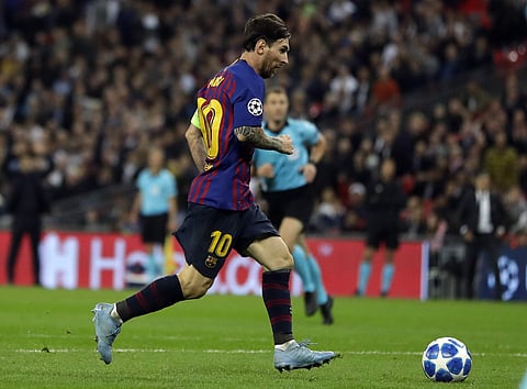 Barcelona forward Lionel Messi scores his side's fourth goal during the Champions League Group B soccer match between Tottenham Hotspur and Barcelona at Wembley Stadium in London. (Photo | AP)