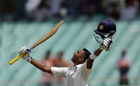 ndia's cricketer Prithvi Shaw celebrates his century during the first day of the first cricket test match between India and West Indies in Rajkot. ( Photo | AP)