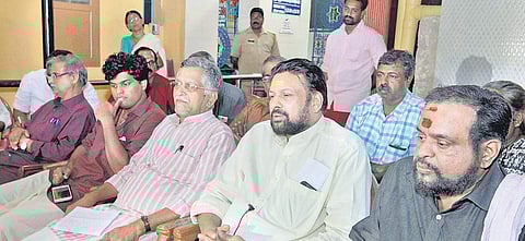 Thantri family members Kandararu Mohanararu, Kandararu Rajeevaru and Kandararu Mahesh Mohanaru with Sasikumara Varma, of the Pandalam royal family. (Shaji Vettipuram | EPS)