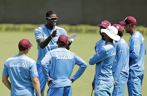 West Indies' cricket captain Jason Holder speaks to teammates during a practice session. (Photo | File/AP)